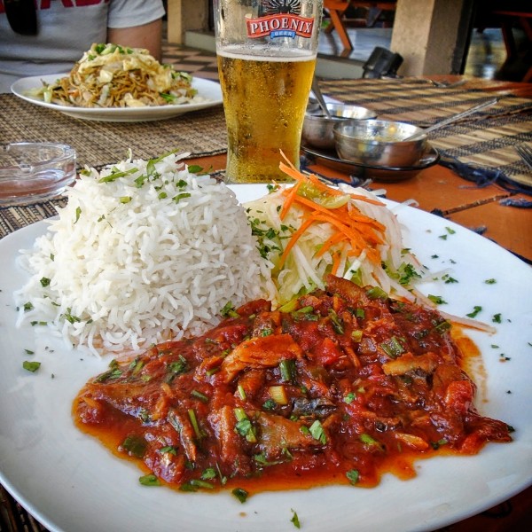 Salted Fish Rougaille, served with rice and salad at a local restaurant in Trou-aux-Biches.